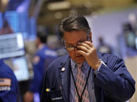 Wall Street ticks down on jobs data